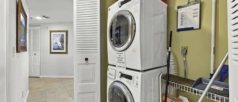 Enjoy the convenience of a private stacked washer and dryer in this Bahia Del Mar vacation condo, making extended stays easy and comfortable.