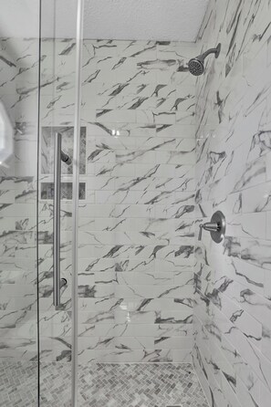 Combined shower/tub, hair dryer, towels, soap