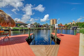 Guests can relax on the dock with a chair and table overlooking the water.