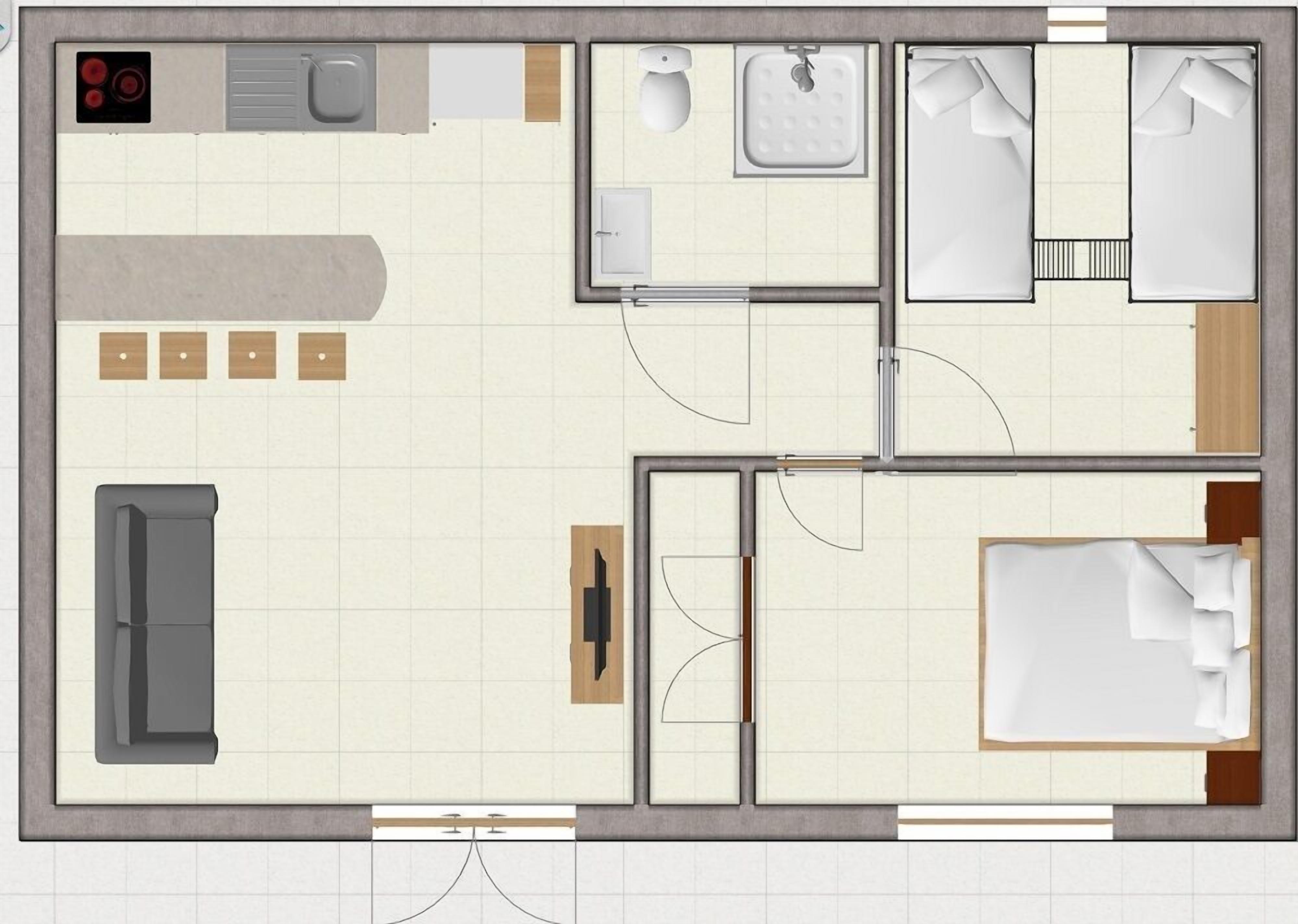 A hotel room layout with a bed, a desk, a chair, a bathroom, and a kitchenette.