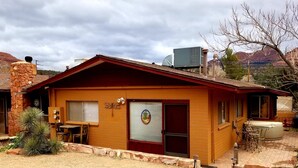 A single-story building with a red roof and a large garage door. - Great Location Best Value Beautiful House and Guest House with Views (Sedona)