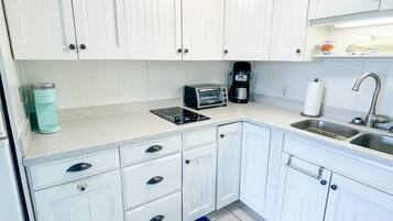 Fridge, microwave, stovetop, coffee/tea maker