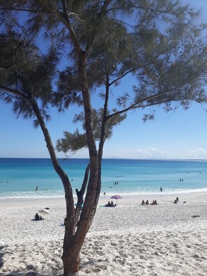 On the beach, sun-loungers