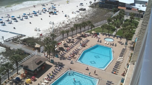 A resort with two swimming pools, beach access, and a view of the ocean. - The Summit Resort,last min deal, Oct.1-3rd,10% disc. 20% off premisis drink,food (Panama City Beach)