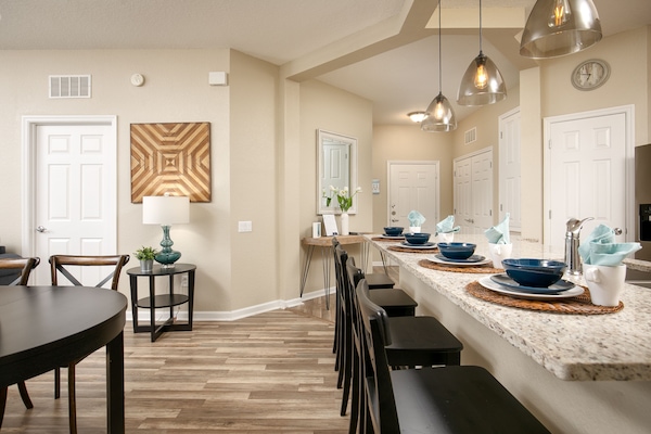 open kitchen with a huge granite counter top