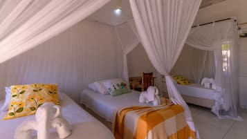 Habitació triple prèmium | Roba de llit d'alta qualitat i matalassos amb encoixinament addicional