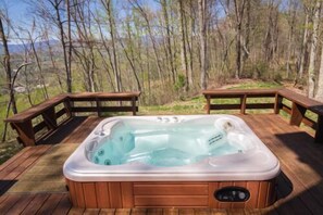 A hot tub on a wooden deck with railings, surrounded by trees and a view of the landscape. - Gated Luxury Lodge - Hot Tub, Mountain Views, Stunning Gardens, Secluded (Franklin)