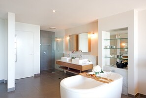 Bathtub, towels, toilet paper