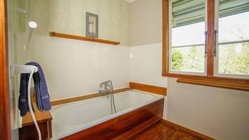 Bathtub, hair dryer, towels