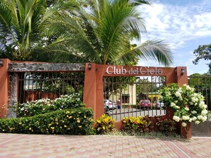 Welcome to Club del Cielo, surrounded by lush greenery and beautifully maintained gardens.