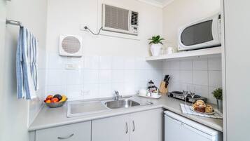 Fridge, microwave, toaster, cookware/dishes/utensils