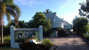 A sign for a property named "Seacliff" with a road leading to a building. - Oceanview Sealofts: NO spiral staircase & only 25 steps to ocean (Frigate Bay)