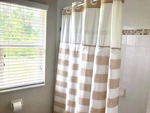 Combined shower/tub, hair dryer, towels, soap