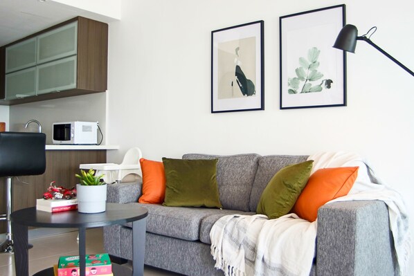 Apartment | Living area | 43-inch flat-screen TV with cable channels, TV, books - Phaedrus Living: Seaside Luxury Flat Lighthouse 53 (Paphos)