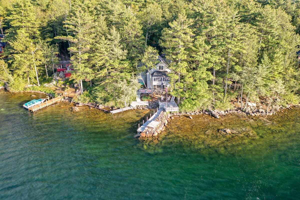 Lovely waterfront home on the lake with 24' boat dock and fire-pit.
