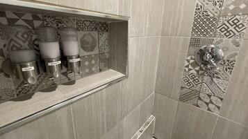 Shower, rainfall showerhead, hair dryer, towels