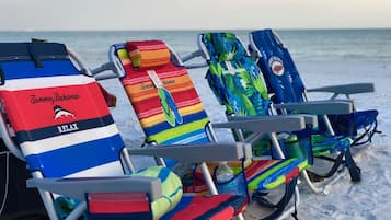 On the beach, sun-loungers, beach towels