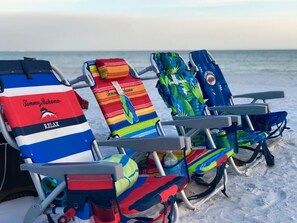 On the beach, sun loungers, beach towels