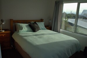 3 bedrooms, desk, iron/ironing board, travel crib - Beachfront Bach with Amazing Views (Pukehina)