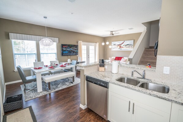 Enjoy meals in the central island kitchen with ample counter space and a dining area.