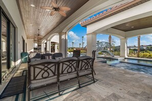 Terrace/patio - Eagle Bay: Game Loft, Theater, Private Pool with Lazy River, Golf Views, Near Disney (Kissimmee)