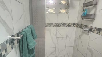 Combined shower/tub, hair dryer, towels, soap