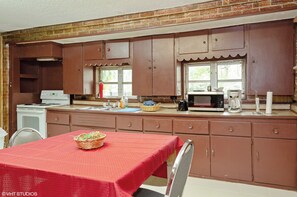 Enjoy cooking in this kitchen with a microwave, coffee maker, and sink.