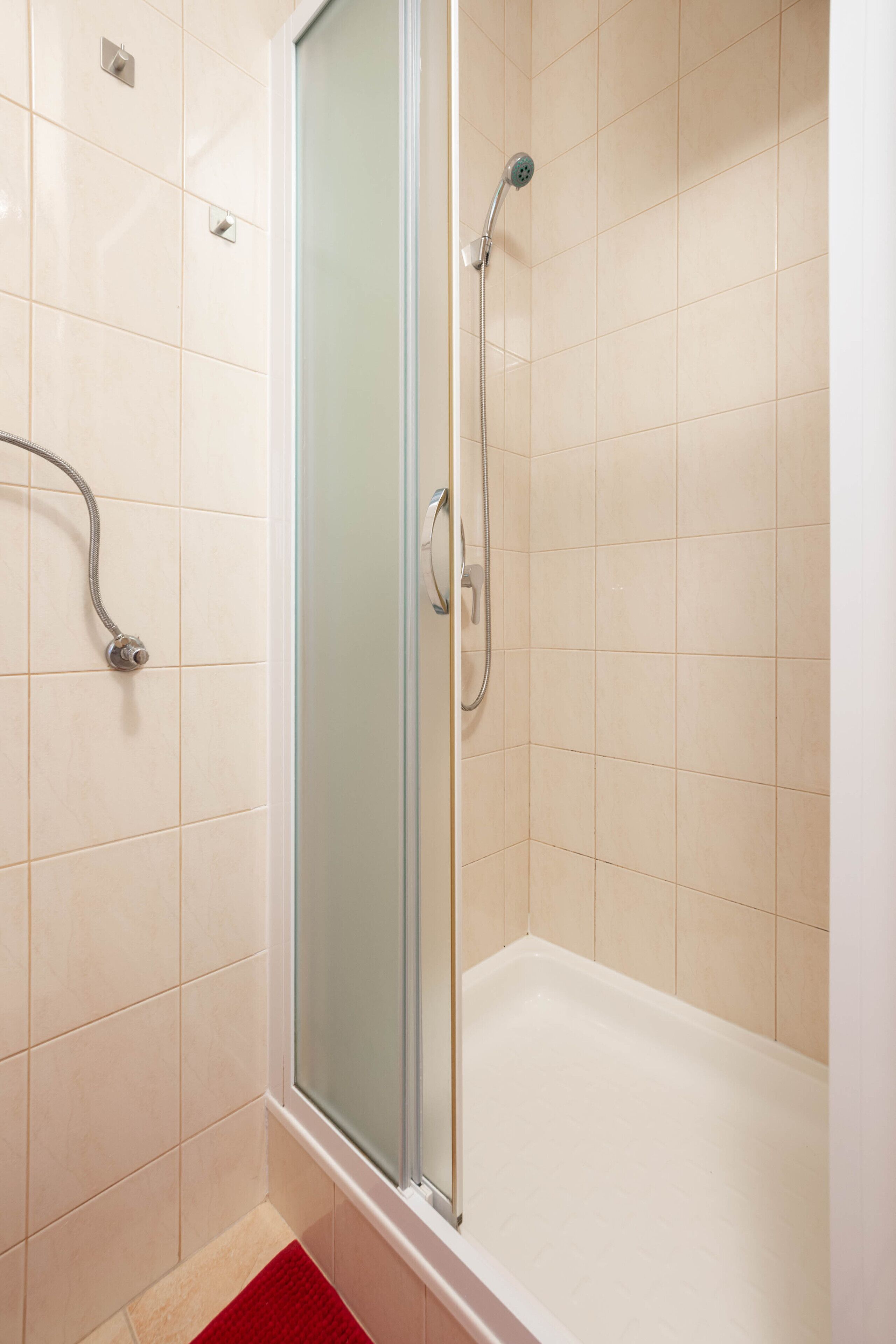 Shower, hair dryer, slippers, towels