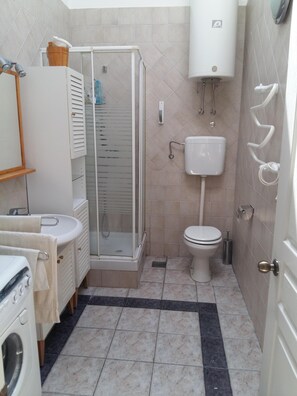 Shower, hair dryer, towels, soap