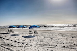 Relax under the shade of our beach umbrellas, surrounded by the soothing sound of the ocean.