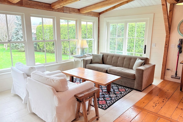 Sitting area and window room looks over the back yard and is adjacent to kitchen