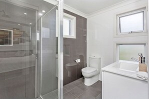 Bathtub, hair dryer, towels, soap