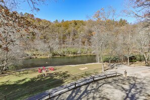 A park with a pond, picnic area, and walking paths.