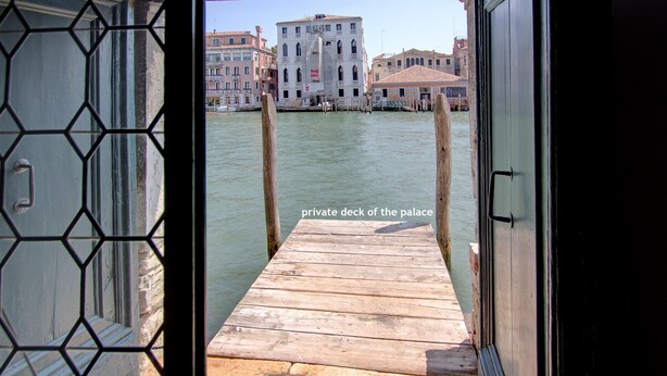 A wooden dock leading to a private deck of a palace. - MOCENIGO aperitif (Venezia)