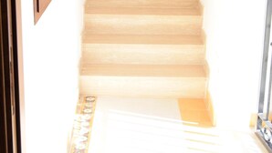A staircase with wooden steps leading upwards.
