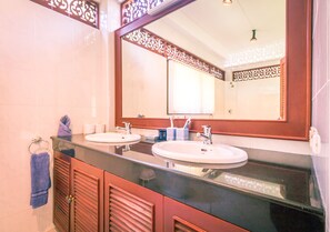 Shower, hair dryer, towels, toilet paper