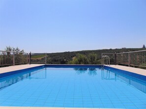 Seasonal outdoor pool, pool umbrellas, pool loungers