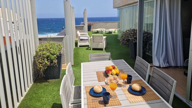 A terrace with a table set for breakfast, overlooking the ocean. - Sea Terrace (Socorro, El (Guimar))