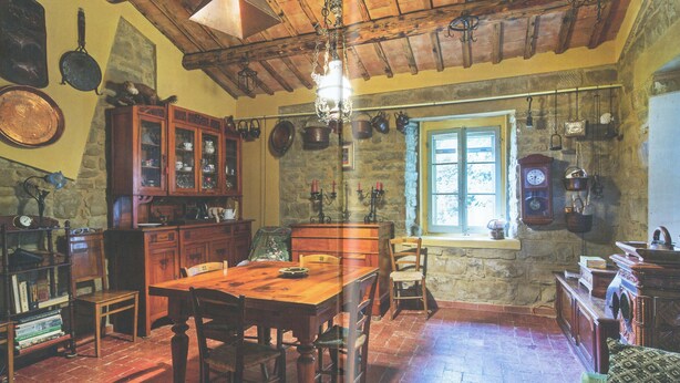 A rustic kitchen with wooden furniture, stone walls, and a large window. - FANTASTIC RURAL HOUSE IN FULL RELAXATION IN THE HILLS WITH SWIMMING POOL (CIVITELLA DI ROMAGNA)