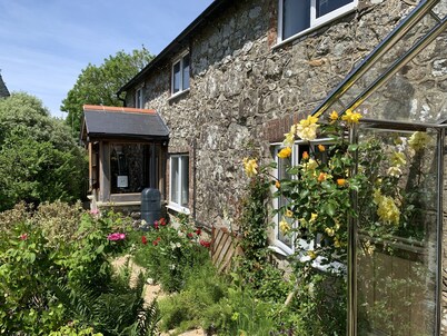 Cottage Set In Rolling Countryside