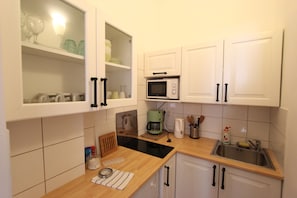 Fridge, microwave, stovetop, coffee/tea maker