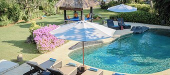 Fabulous villa right on the beach with large pool, tropical garden & staff