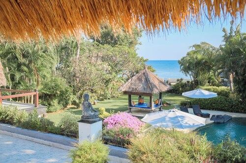 Fabulous villa right on the beach with large pool, tropical garden & staff