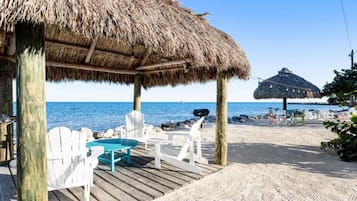 On the beach, sun-loungers, beach towels