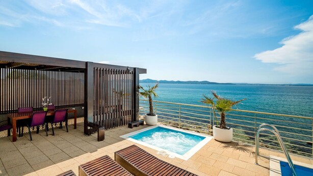 A rooftop terrace with a pool, seating area, and a view of the sea. - Stunning private villa for 12 guests with hot tub, private pool, WIFI, A/C, TV and patio (Zadar)