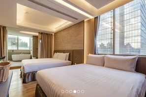 A hotel room with two beds, a large window, a bathtub, and a view of the city. - Wow-happy Hotel Taipei (Taipei)