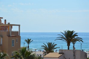 On the beach, sun-loungers