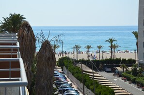 On the beach, sun-loungers