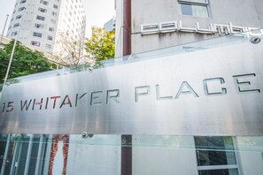 A building with a sign reading "15 WHITAKER PLACE". - Columbia Apartments (Auckland)