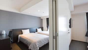 Premium bedding, desk, laptop workspace, blackout curtains